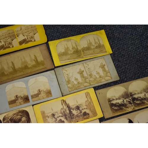 163 - A BOX, to include: 34 stereocards, approx 70 misc. photographs and an old school atlas. (Small ... 