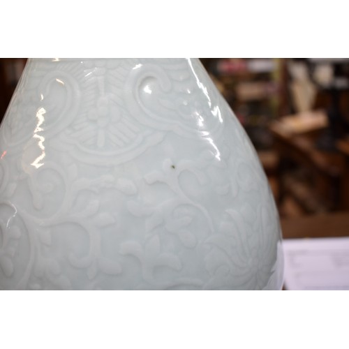 1570 - A Chinese pale celadon vase form table lamp, on carved wooden base, height excluding fitting 39cm.... 