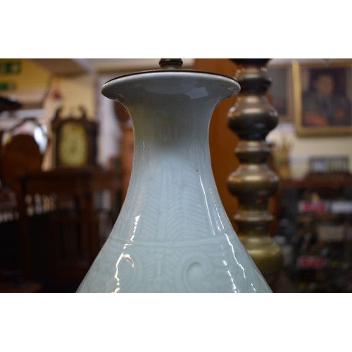 1570 - A Chinese pale celadon vase form table lamp, on carved wooden base, height excluding fitting 39cm.... 