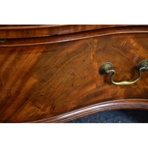 1458 - A good George III figured mahogany serpentine fronted chest of drawers, the frieze drawer with a bru... 