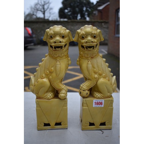 1606 - A pair of Chinese yellow glazed dogs of fo, 30cm high.