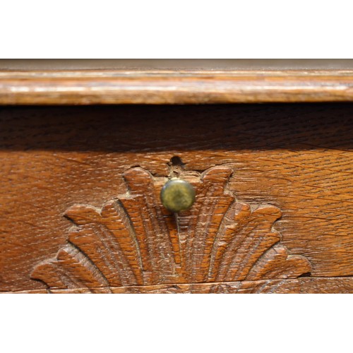 1184 - A pair of Continental oak and marble top bedside tables, 53.5cm wide.