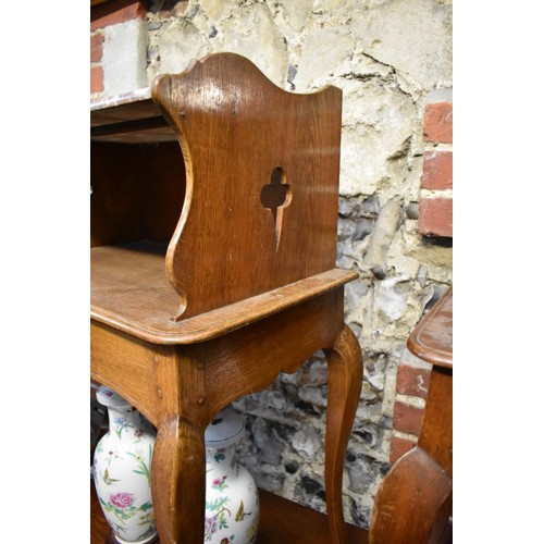 1184 - A pair of Continental oak and marble top bedside tables, 53.5cm wide.