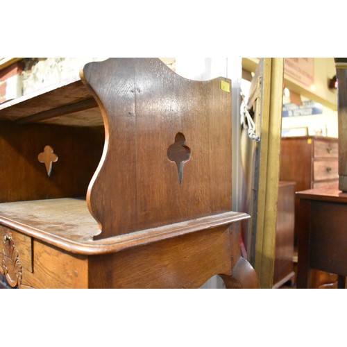 1184 - A pair of Continental oak and marble top bedside tables, 53.5cm wide.