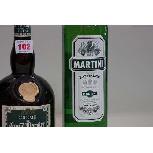 102 - A 70cl bottle of Grand Marnier liqueur; together with a 75cl bottle of Martini extra dry; and a 1 li... 