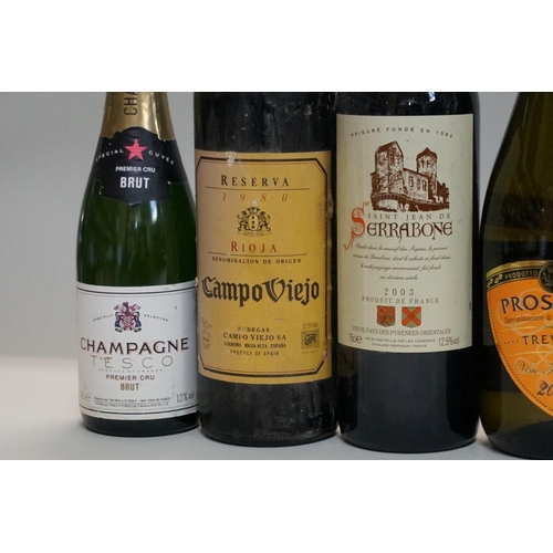 143 - A mixed group of wine, to include: Campo Viejo Riojo, 1980; and various sparkling wines. (10)... 