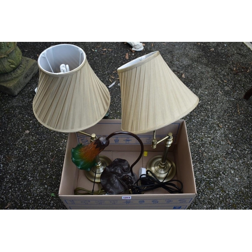 1054 - A pair of lacquered brass table lamps; together with a Tiffany style lamp.Collection of this lot is ... 