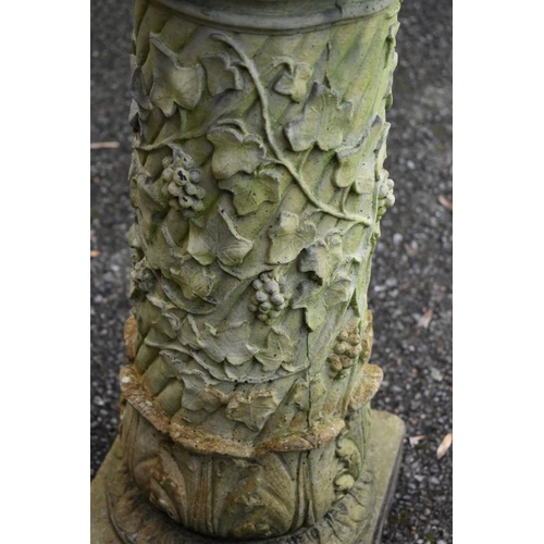 1055 - A reconstituted stone pillar; together with a cast iron table base and two brackets.Collection of th... 