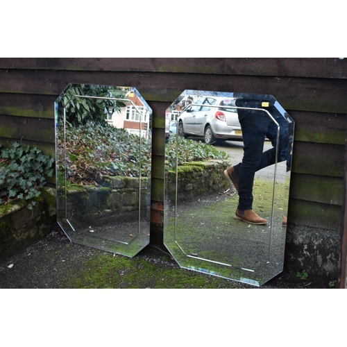 1057 - A pair of modern wall mirrors, 85cm high x 60cm wide.Collection of this lot is strictly by appointme... 