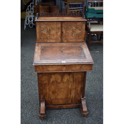 1073 - A Victorian walnut piano top Davenport, 56cm wide x 57cm deep x 106cm high.Collection of this lot is... 