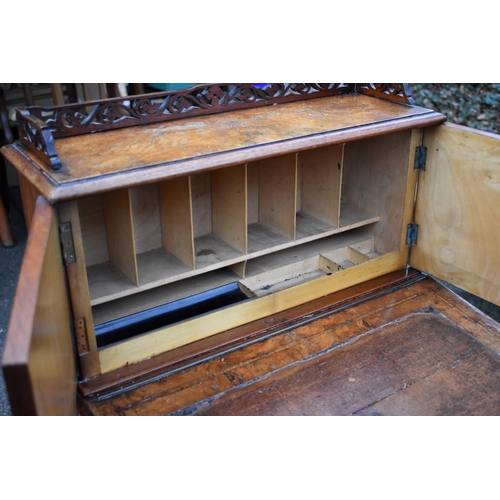 1073 - A Victorian walnut piano top Davenport, 56cm wide x 57cm deep x 106cm high.Collection of this lot is... 