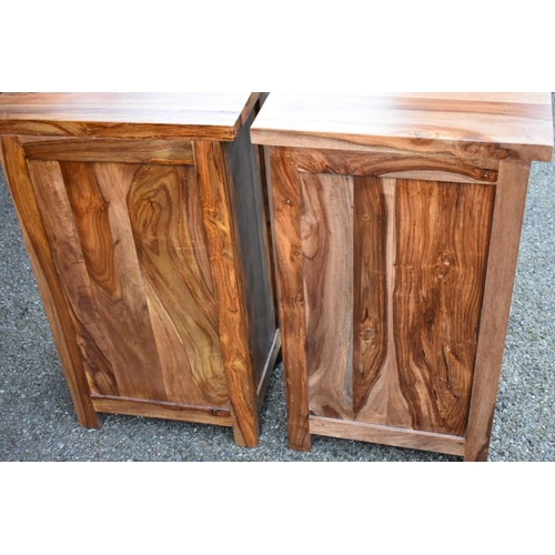 1074 - A pair of hardwood bedside chests, 40cm wide x 30cm deep x 65.5cm high.Collection of this lot is str... 