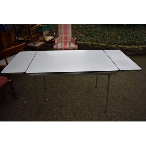 1077 - A 1970s chrome folding drawleaf kitchen table.Collection of this lot is strictly by appointment on S... 