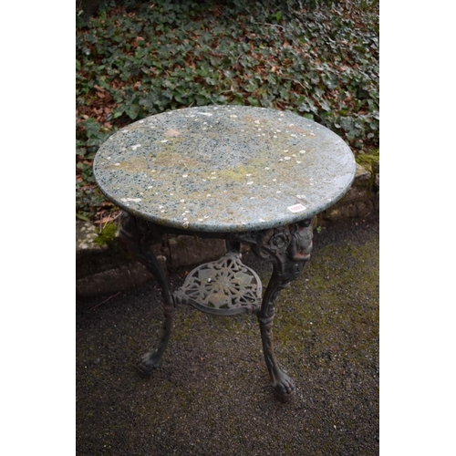 1082 - An old cast iron pub table having marble top, 61cm wide x 73cm high.Collection of this lot is strict... 