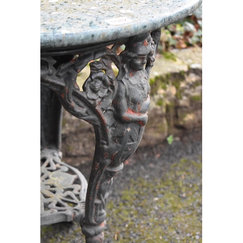 1082 - An old cast iron pub table having marble top, 61cm wide x 73cm high.Collection of this lot is strict... 