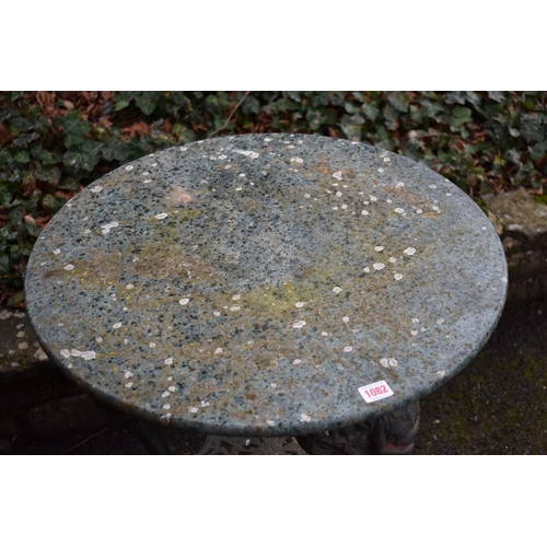 1082 - An old cast iron pub table having marble top, 61cm wide x 73cm high.Collection of this lot is strict... 