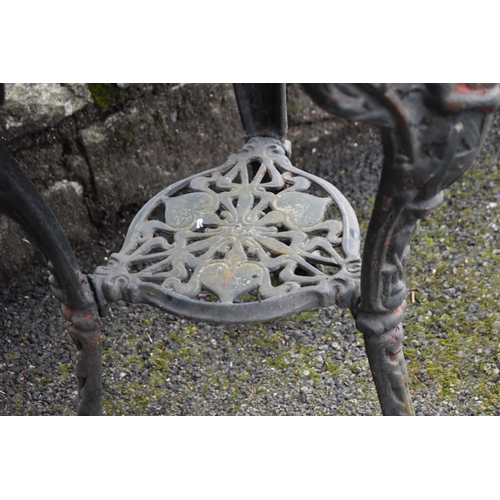 1082 - An old cast iron pub table having marble top, 61cm wide x 73cm high.Collection of this lot is strict... 