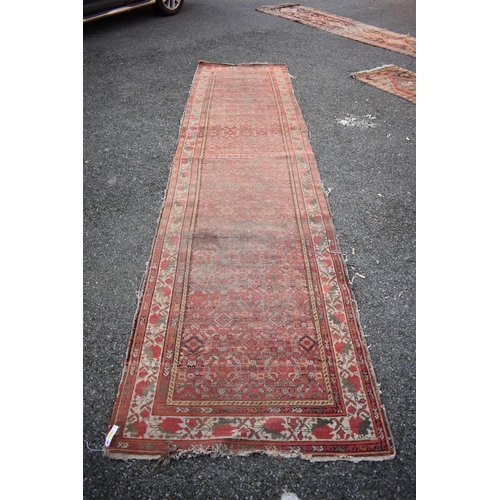 1090a - A Persian runner, having geometric decoration to central field with floral borders, 405 x 100cm.... 