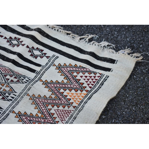 1091 - An old flatweave rug, having geometric decoration, 266 x 155cm.