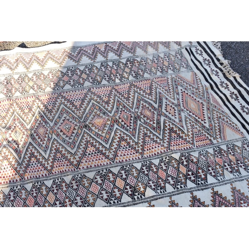 1091 - An old flatweave rug, having geometric decoration, 266 x 155cm.