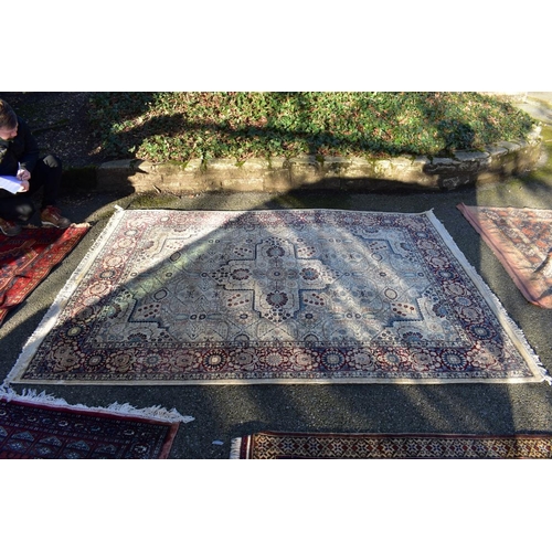 1096 - A Persian silk rug, having cross to central field, with floral borders, 256 x 185cm.... 