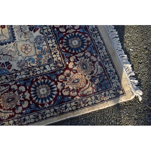 1096 - A Persian silk rug, having cross to central field, with floral borders, 256 x 185cm.... 