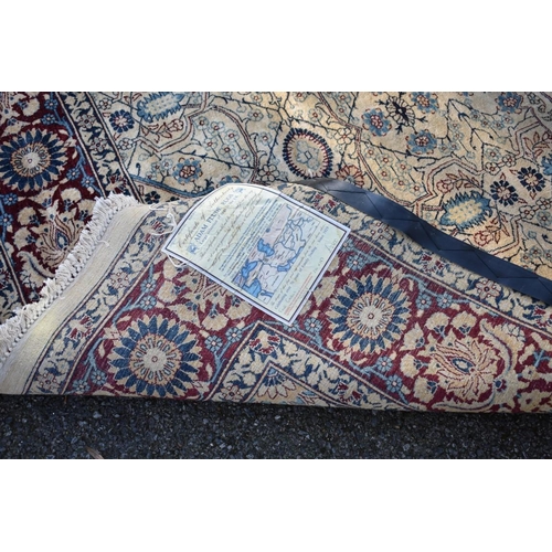 1096 - A Persian silk rug, having cross to central field, with floral borders, 256 x 185cm.... 