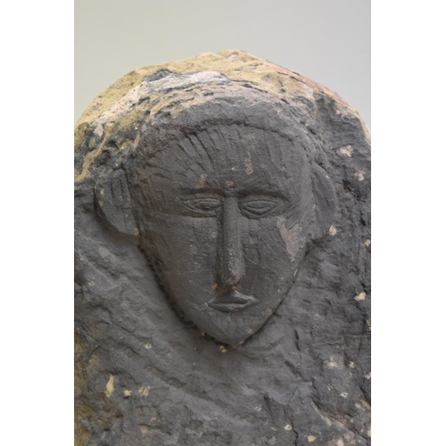 1771 - A Celtic style carved stone relief, 46cm high x 36.5cm wide.Provenance: by repute from Woburn A... 