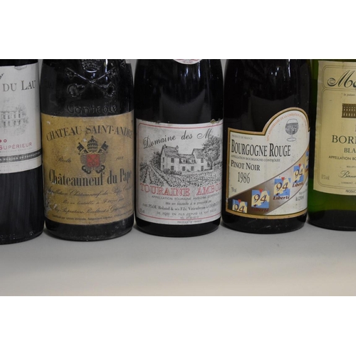 628 - Nine various bottles of French wine, to include: a 75cl bottle of Chateau Saint-Andre Chateauneuf du... 