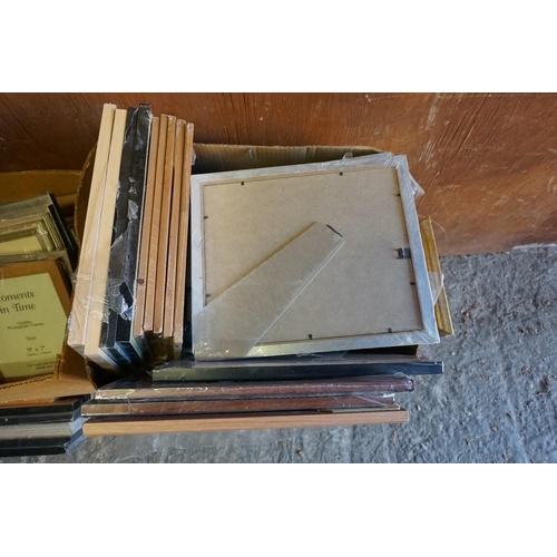 1012 - Four boxes of photograph frames. 