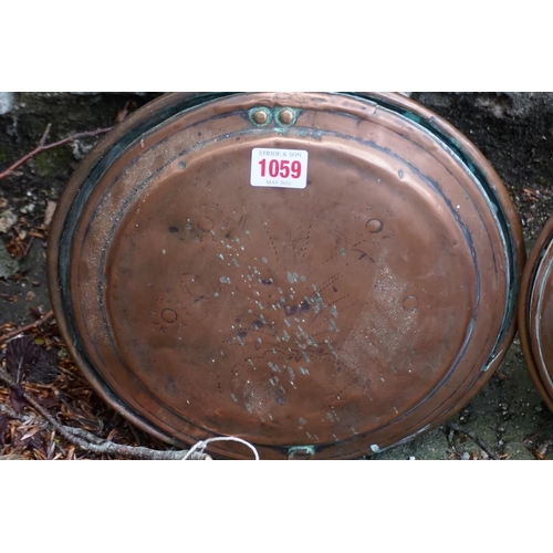 1059 - Two old copper warming pans.