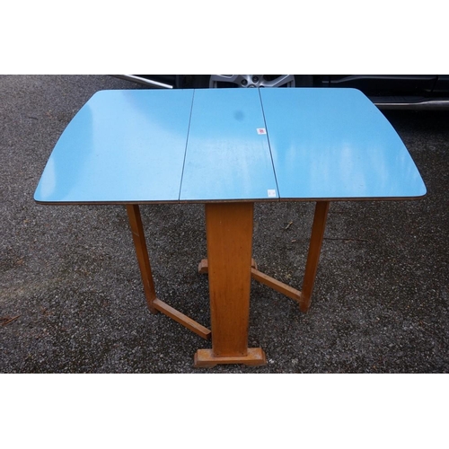 1061 - A 1950s blue melamine gateleg table.