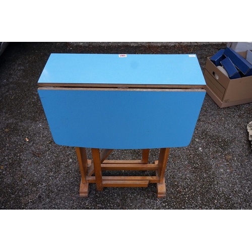 1061 - A 1950s blue melamine gateleg table.