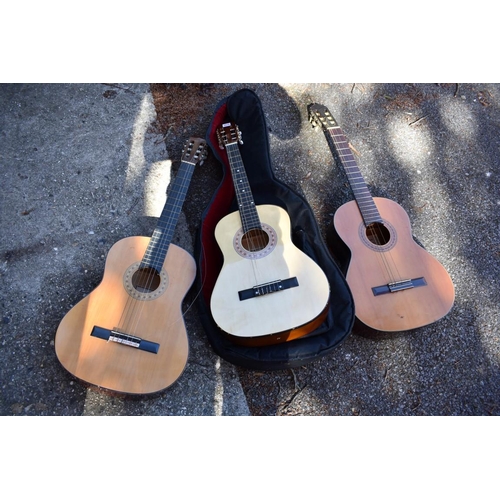 1070 - Three acoustic guitars. 