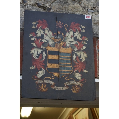 1082 - An antique armorial painted oak panel, inscribed with motto 'Semper Sapit Suprema', 45.5 x 35.5... 