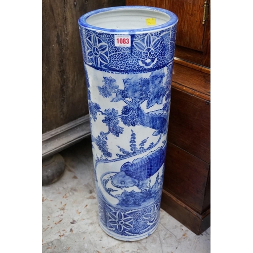 1083 - A Japanese blue and white stickstand, 61cm high, (cracked to rim). 