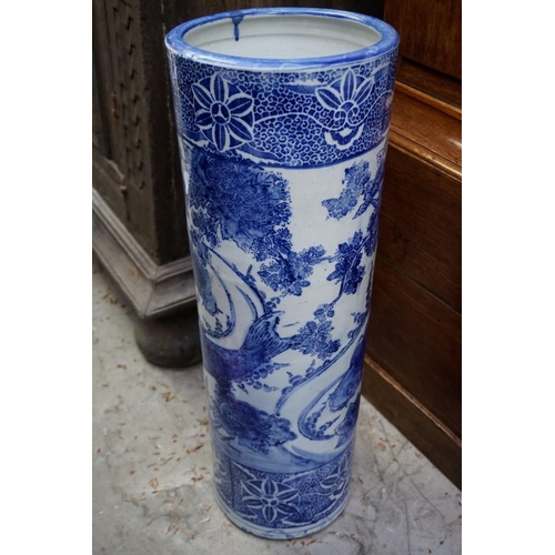 1083 - A Japanese blue and white stickstand, 61cm high, (cracked to rim). 