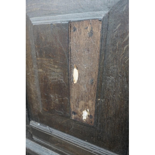 1085 - A carved oak panelled press cupboard, probably late 17th century, 150cm wide. 