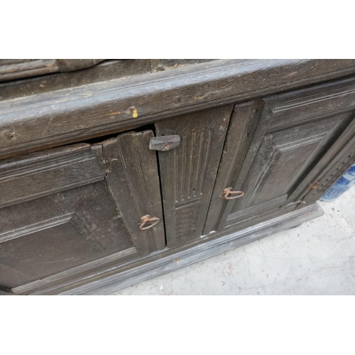 1085 - A carved oak panelled press cupboard, probably late 17th century, 150cm wide. 