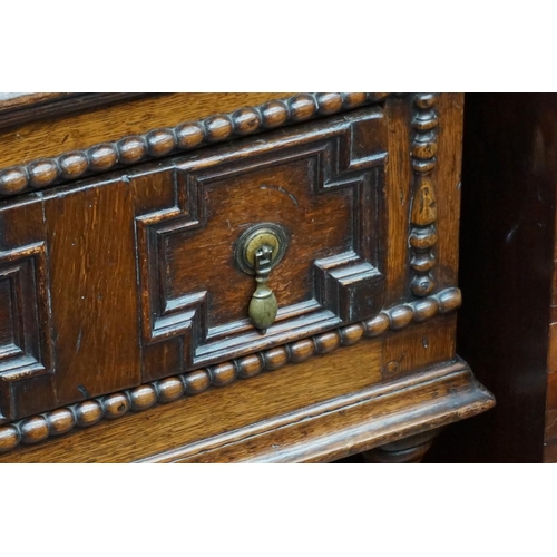 1089 - A reproduction oak geometrically moulded two drawer side table, 106cm wide. ... 