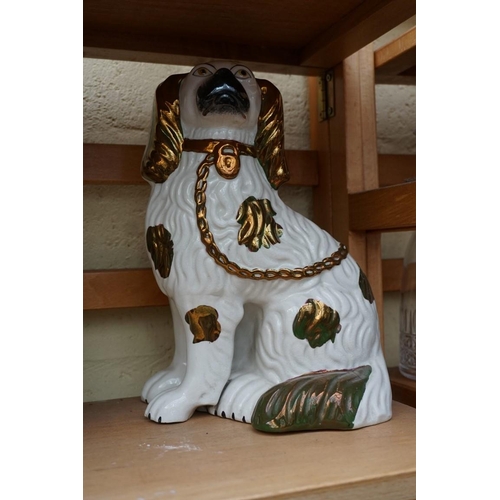 1110 - A pair of Victorian Staffordshire dogs, 28cm high; together with three other items. (5)... 