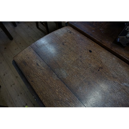 1063 - All Proceeds to St Wilfrid's Hospice: an antique oak gateleg table, 131cm wide.