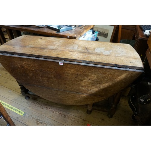 1063 - All Proceeds to St Wilfrid's Hospice: an antique oak gateleg table, 131cm wide.