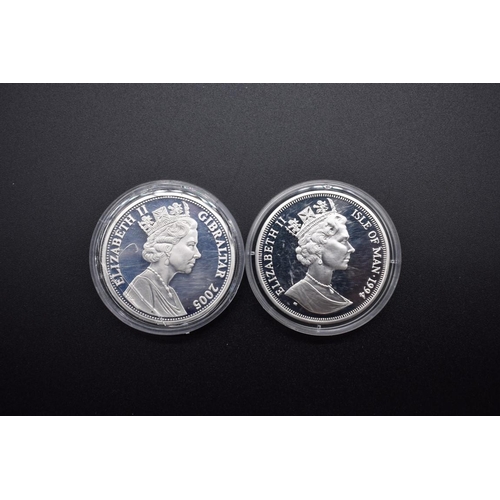 149 - Coins: a Elizabeth II 2005 Gibraltar silver proof £5 coin; together with an Elizabeth II 1994 Isle o... 