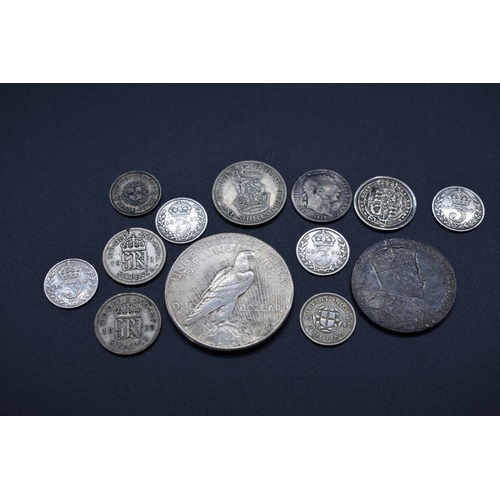 151 - Coins: a US 1925 Peace dollar, Philadelphia Mint; together with a small quantity of UK silver coinag... 