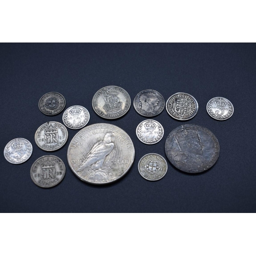 151 - Coins: a US 1925 Peace dollar, Philadelphia Mint; together with a small quantity of UK silver coinag... 