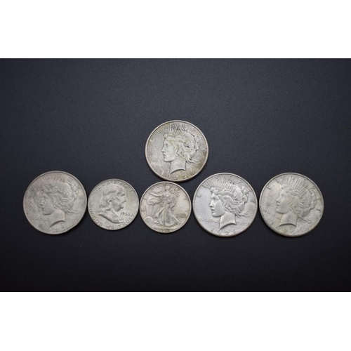 153 - Coins: four US silver peace dollars, 1923, 1925 (2) and 1926; together with two silver half dollars,... 