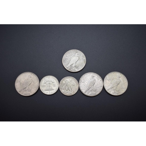 153 - Coins: four US silver peace dollars, 1923, 1925 (2) and 1926; together with two silver half dollars,... 