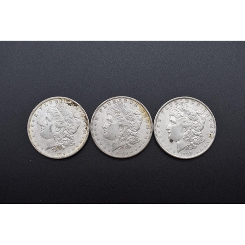 154 - Coins: three US Morgan silver dollars 1889 (2) and 1890.