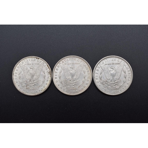 154 - Coins: three US Morgan silver dollars 1889 (2) and 1890.